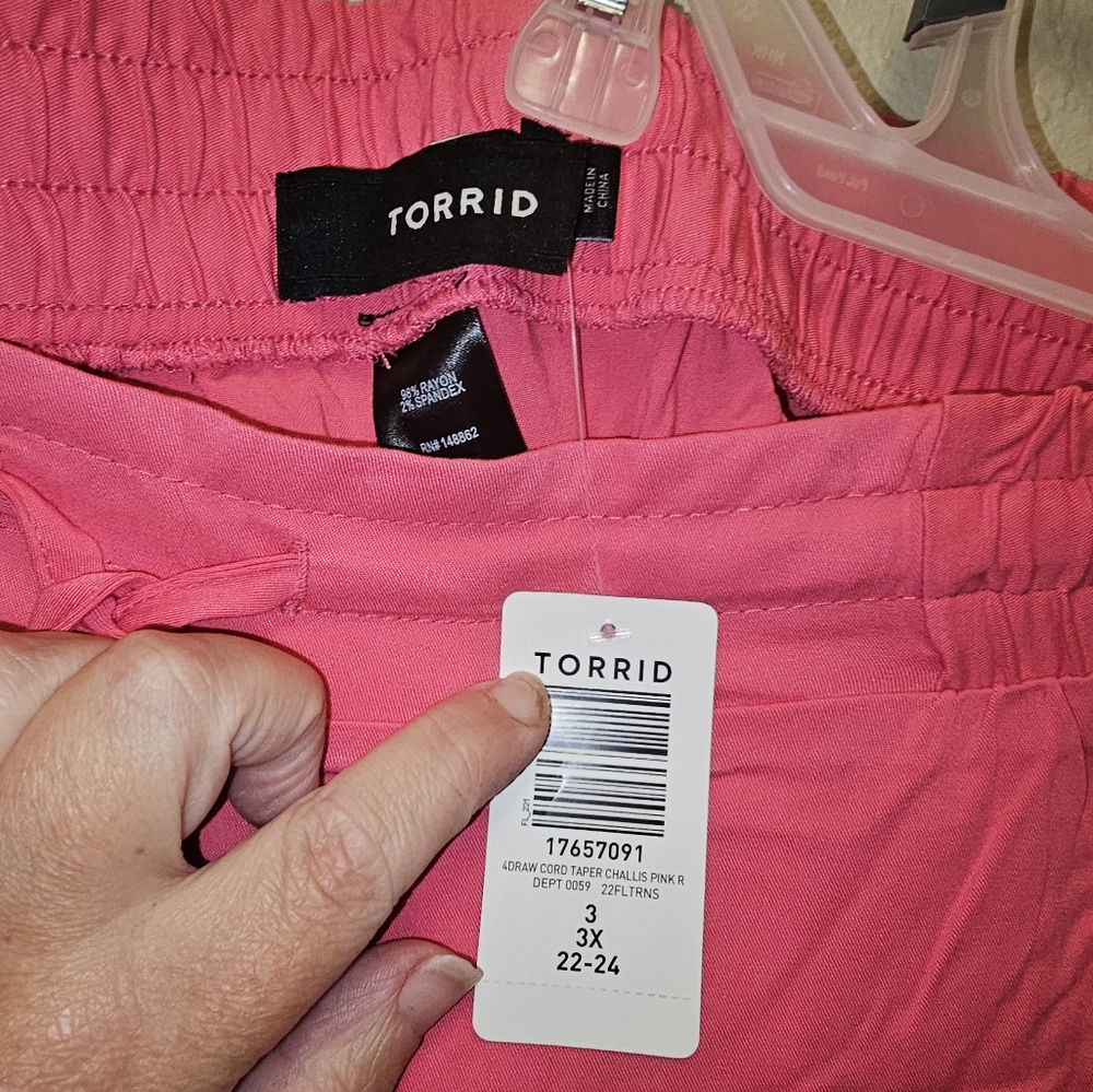 Woman dress pants,  size 3 in Torrid, pink color,  new with tags,  very comforta